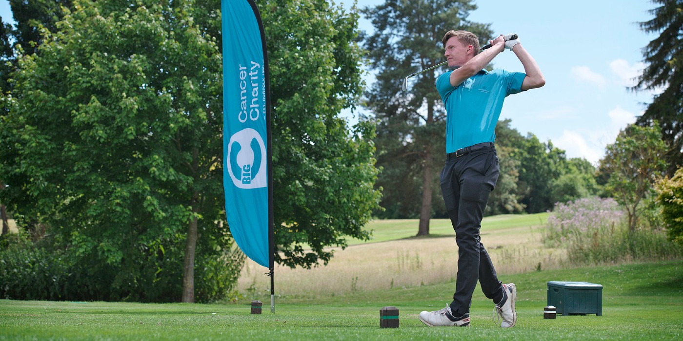 Golfer hitting a golf ball