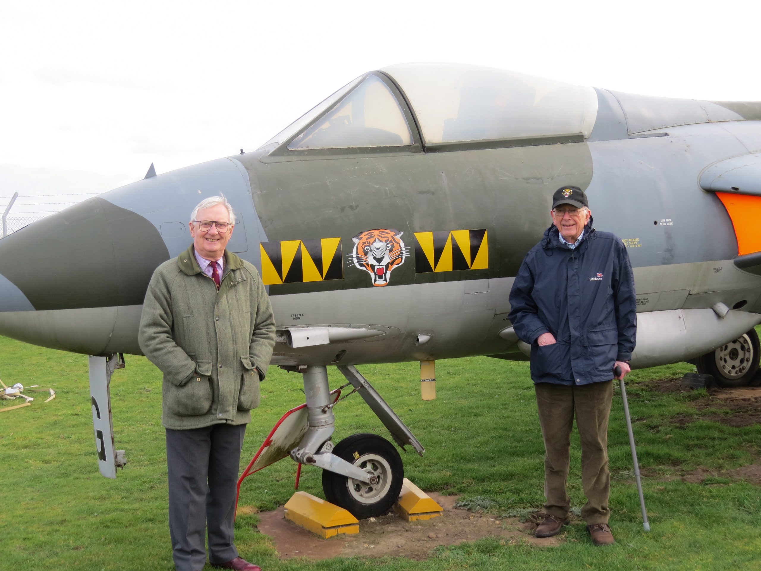 74 Tiger Squadron pilots David Jones and John Atkinson standing in front of a Hawker Hunter, in 74 Squadron markings, at City of Norwich Aviation Museum.  This was the type of jet that they flew when they served with 74 Squadron in the late 1950s at RAF Horsham St Faith.