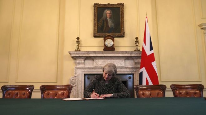 Theresa May signing Article 50 - Image courtesy of PA