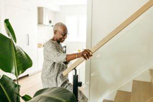 Older lady walking up the stairs 