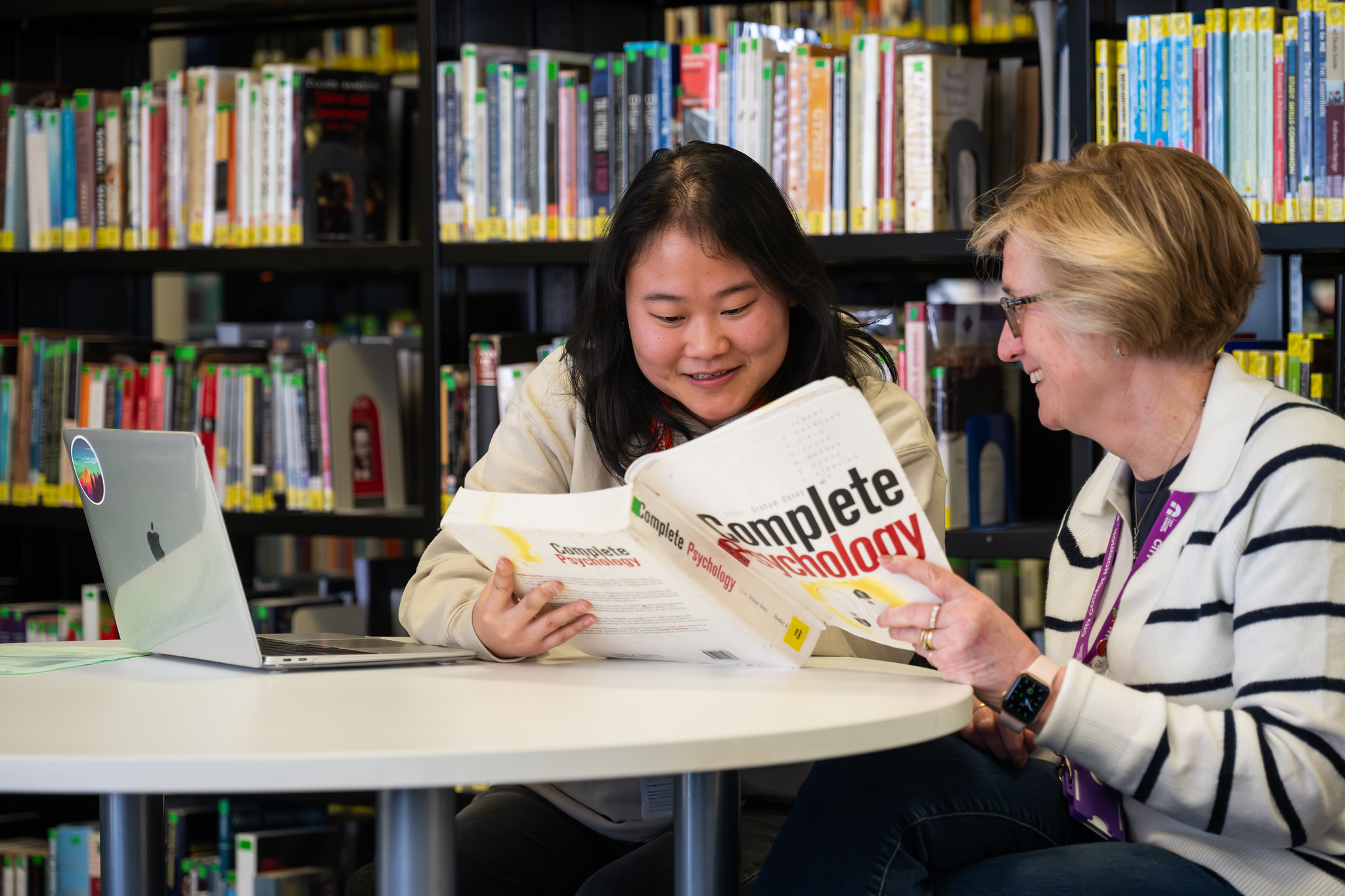 Two adult students studying with City College Norwich.