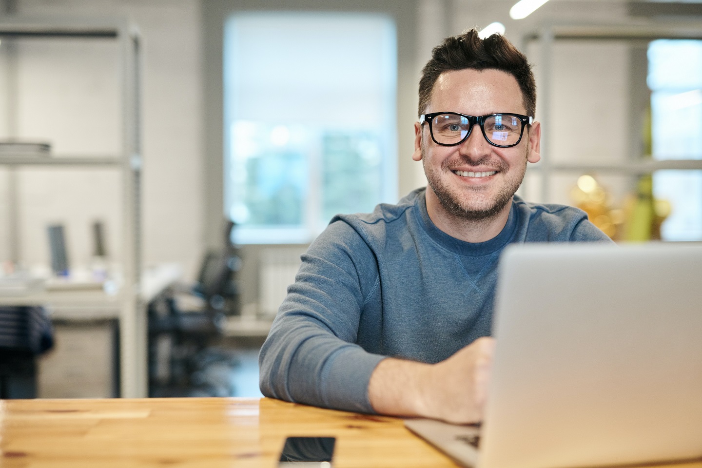 Nm Smiling Man With Laptop Resized.jpg