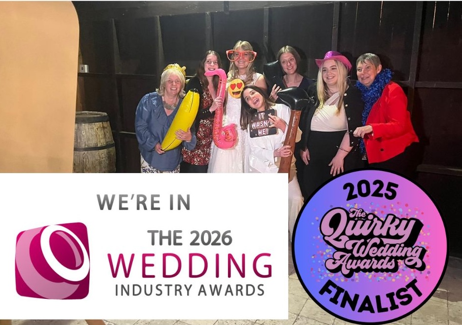 a photo booth in action at a wedding with the two award logos