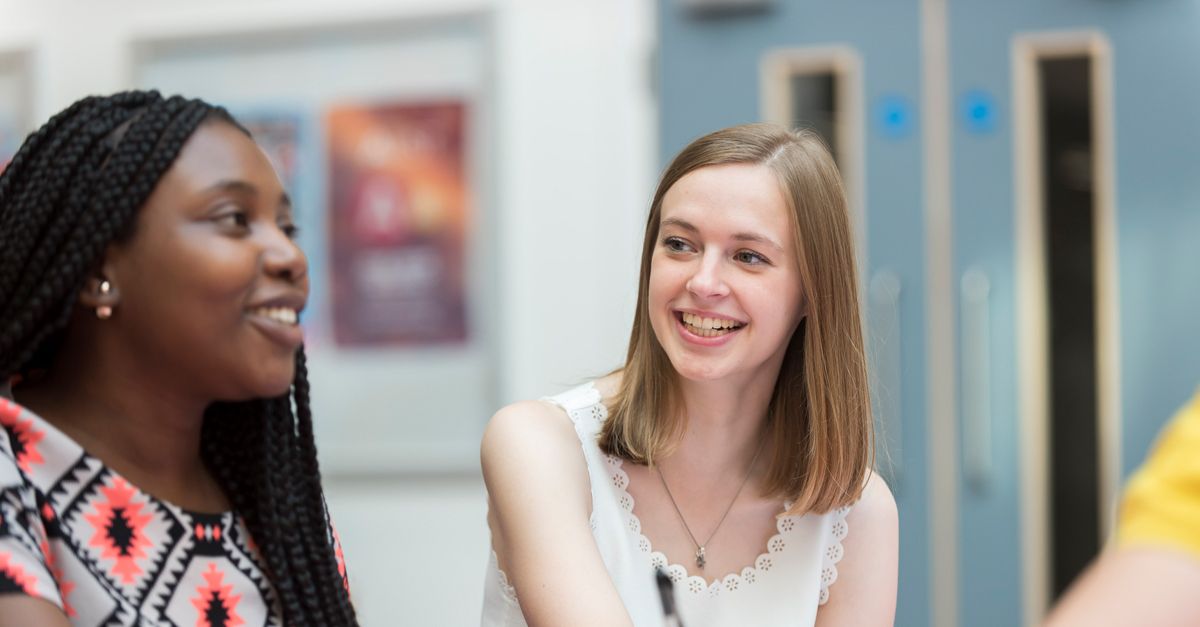 Two UEA students smiling