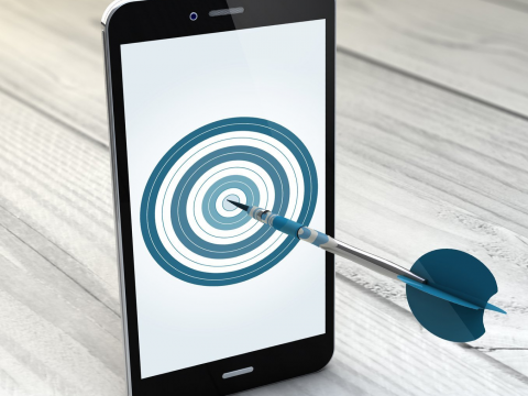 Display retargeting: a tablet showing an image of a target with darts in the centre