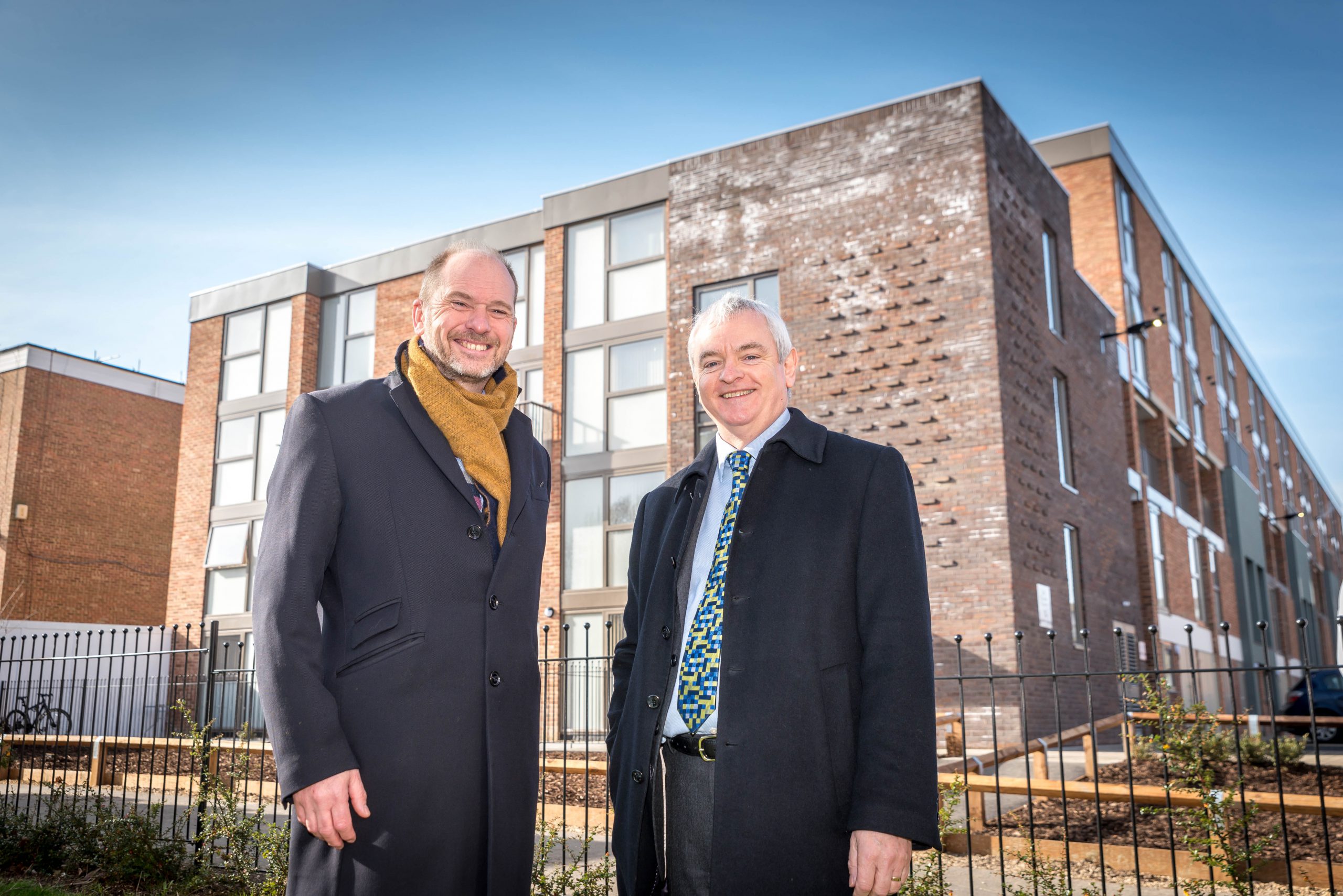 Tony Hall (left) Shows David Orr The Newly Completed Colby Court.