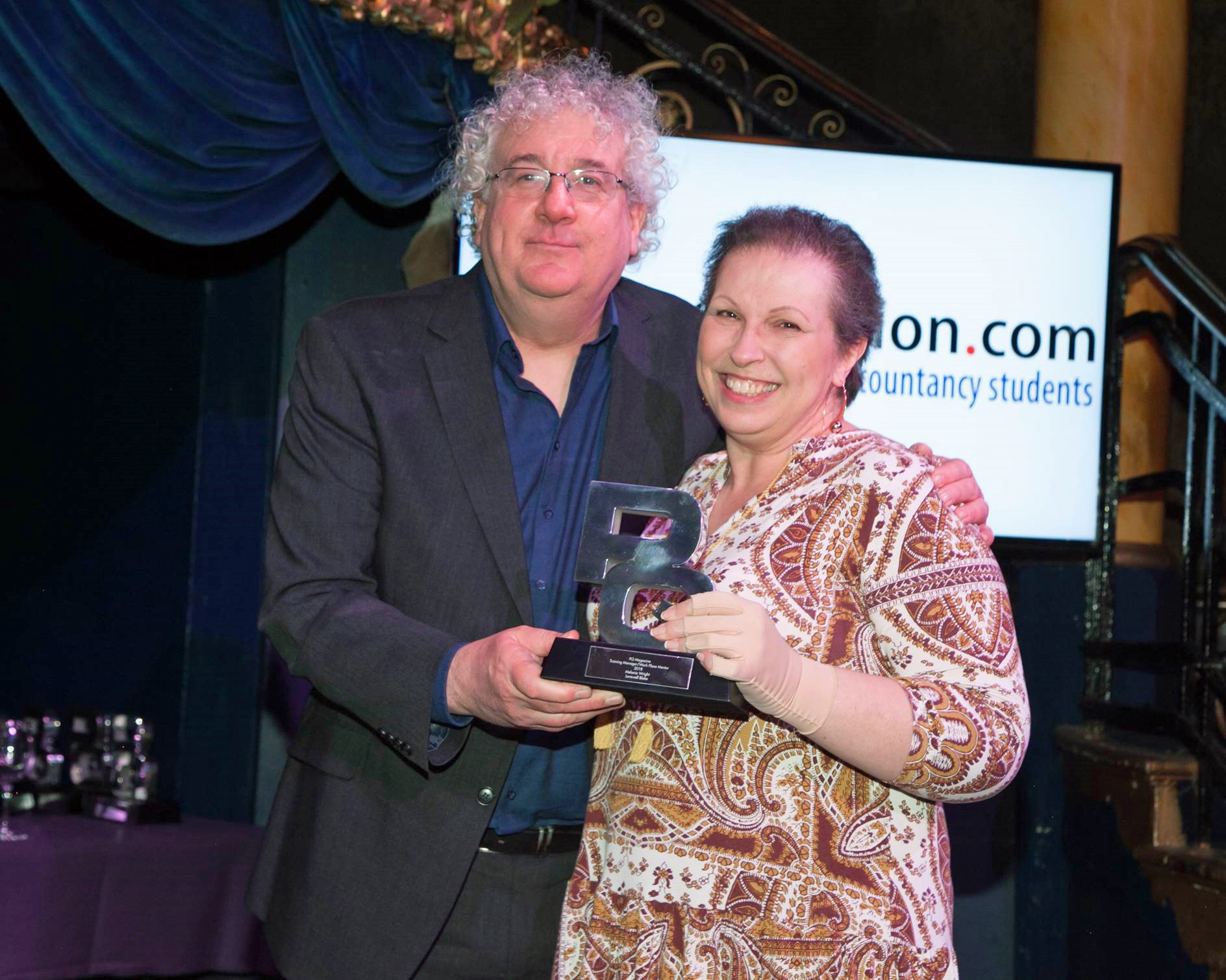 Nm Melanie Wright From Lovewell Blake Receives Her Award From Adam Riches Of Pq Magazine.jpg