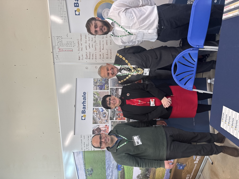 Four people are looking at the camera smiling. Two are members of Barhale staff, the lady in the middle is Kerry Heathcote, Vice Principal and Deputy CEO. The gentleman next to her is the Mayor of King