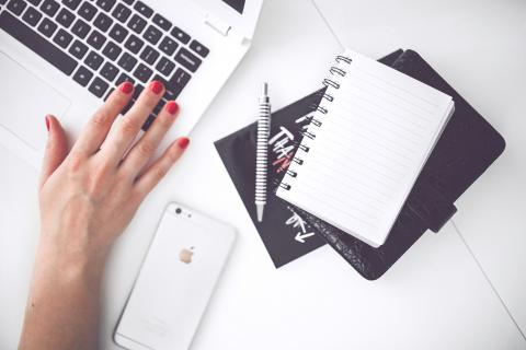 Bc Woman Hand Smartphone Desk.jpg