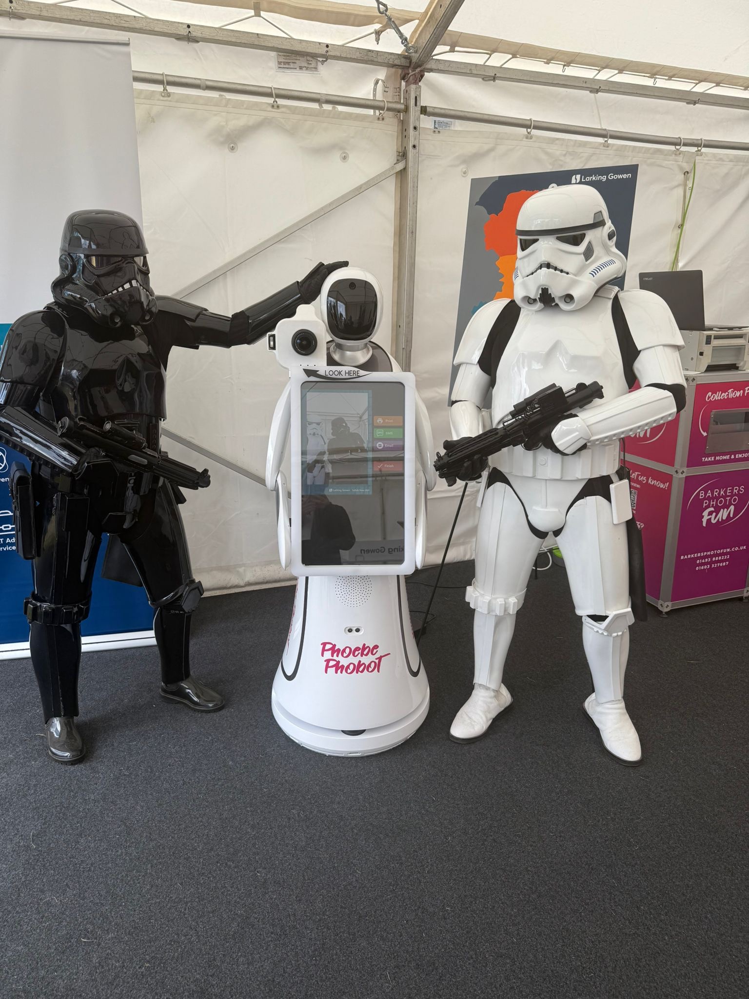 Our photo booth robot alongside a darth vader and storm trooper