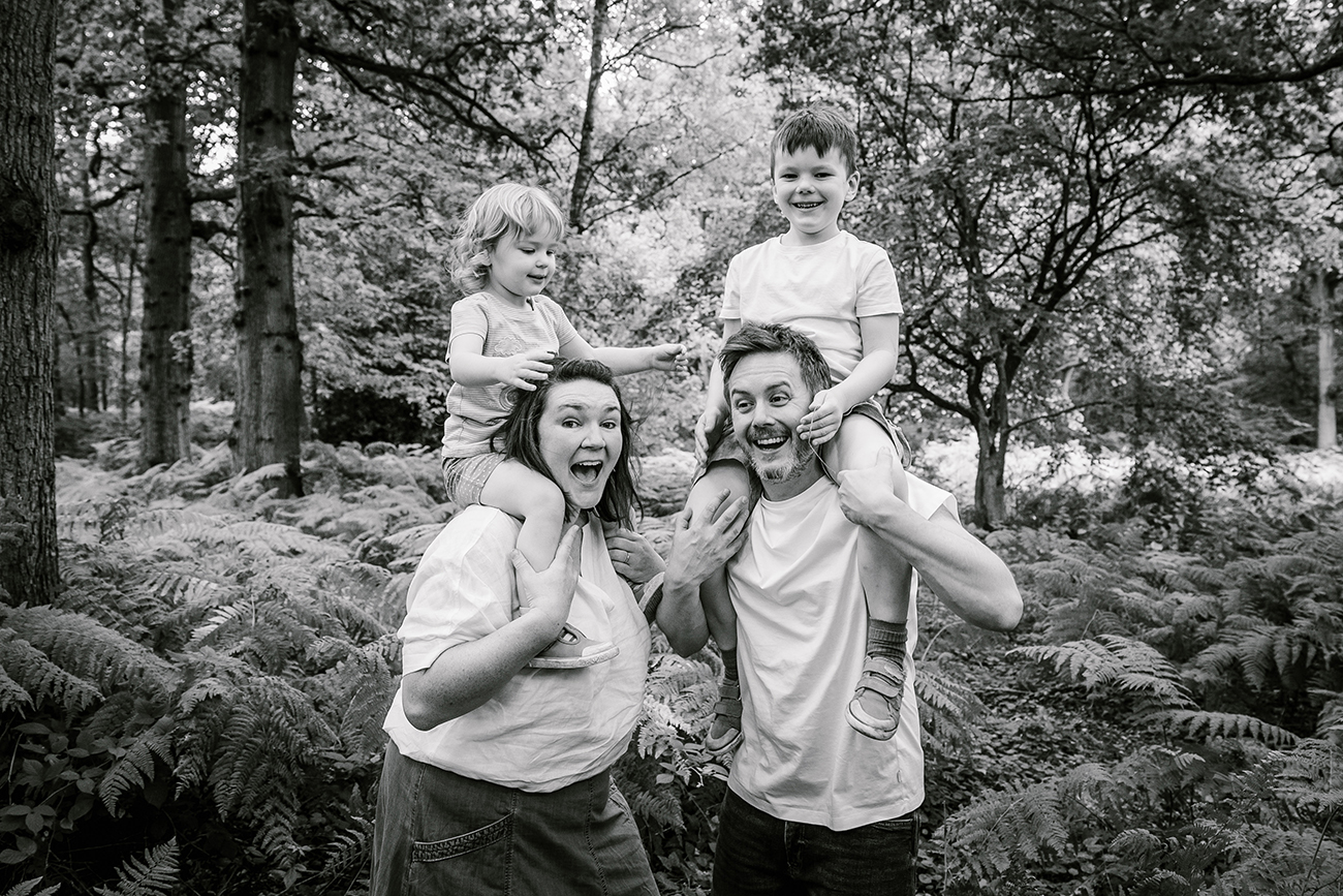 Back and white photo of freelance copywriter Jo Thewlis with her husband and two children.