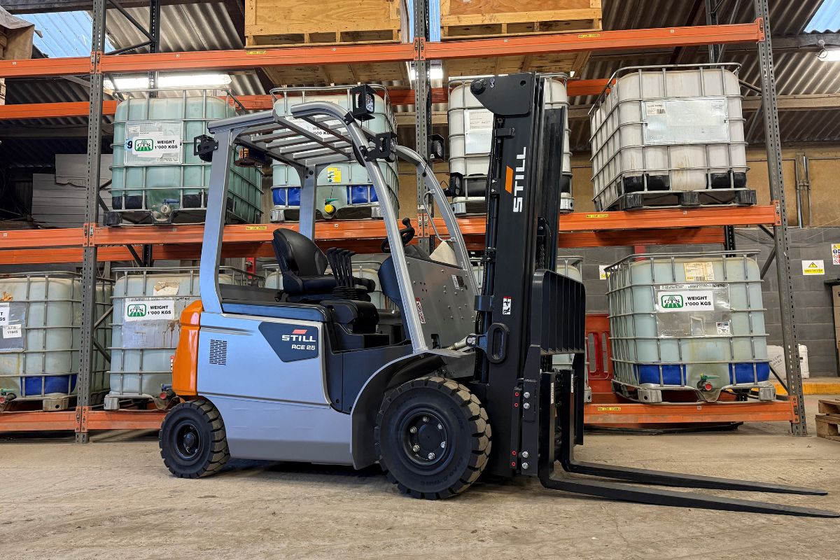 A grey and orange Still forklift